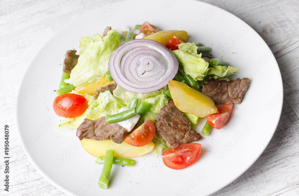 Salad with fried roast beef and vegetables Salad with fried roast beef and vegetables