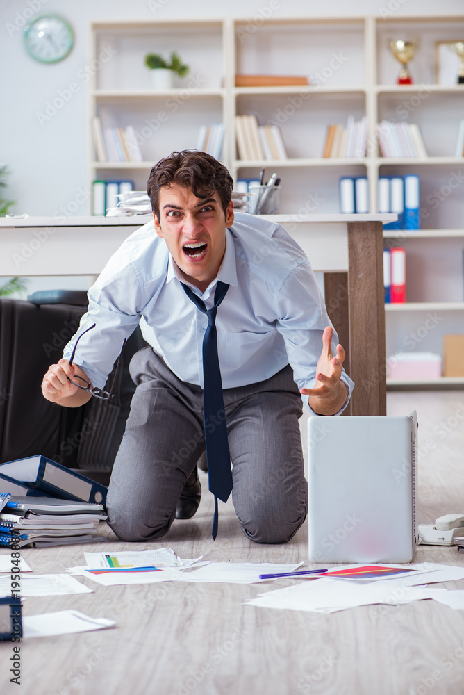 Bankrupt businessman angry in the office floor Bankrupt businessman angry in the office floor