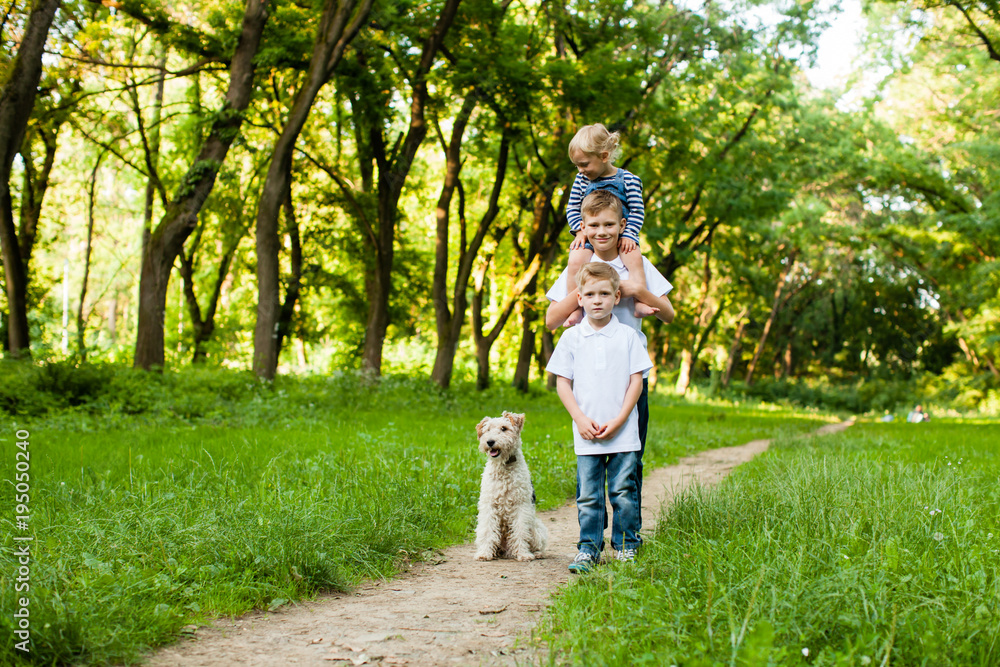 Kids with fox terrier dog Kids with fox terrier dog
