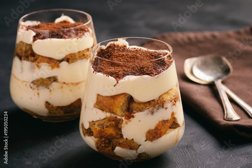 Fotografie Homemade tiramisu cake in glasses, italian dessert.