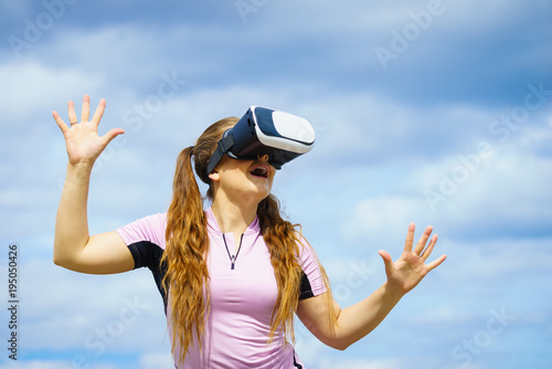 Woman wearing VR outside