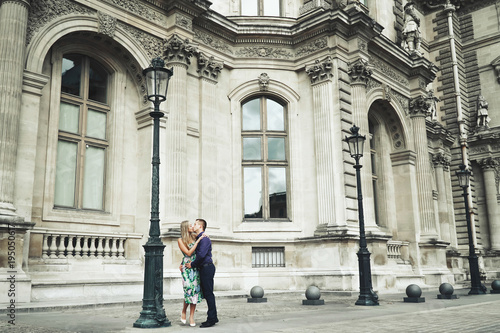 Beautiful couple poses before sightseeing places in Paris, France