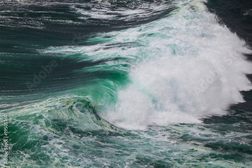 Ocean storm with with big windy waves. Background shot of clear sea water surface