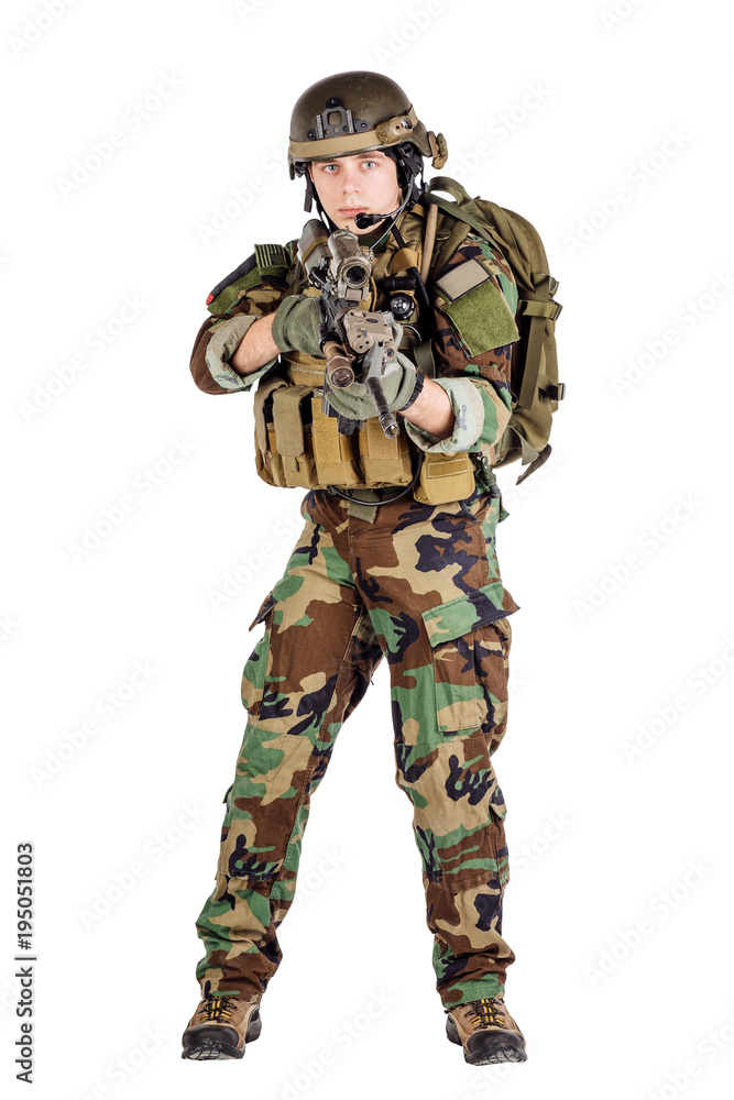 Portrait soldier or private military contractor holding sniper rifle. Portrait soldier or private military contractor holding sniper rifle.