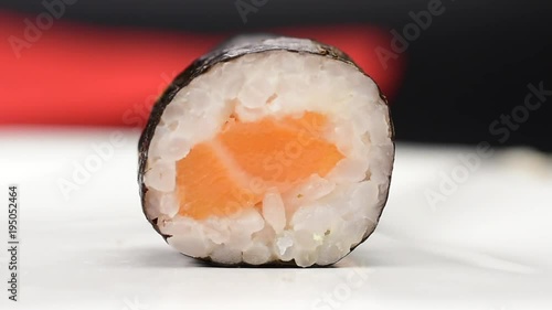 Taking the sushi with hashis  photo