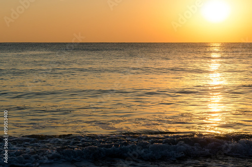 Seascape background of sunlight on the sea surface at sunrise