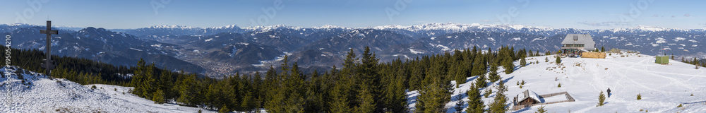 Panoramic landscape of summit cross and hut of mountain Rennfeld Panoramic landscape of summit cross and hut of mountain Rennfeld