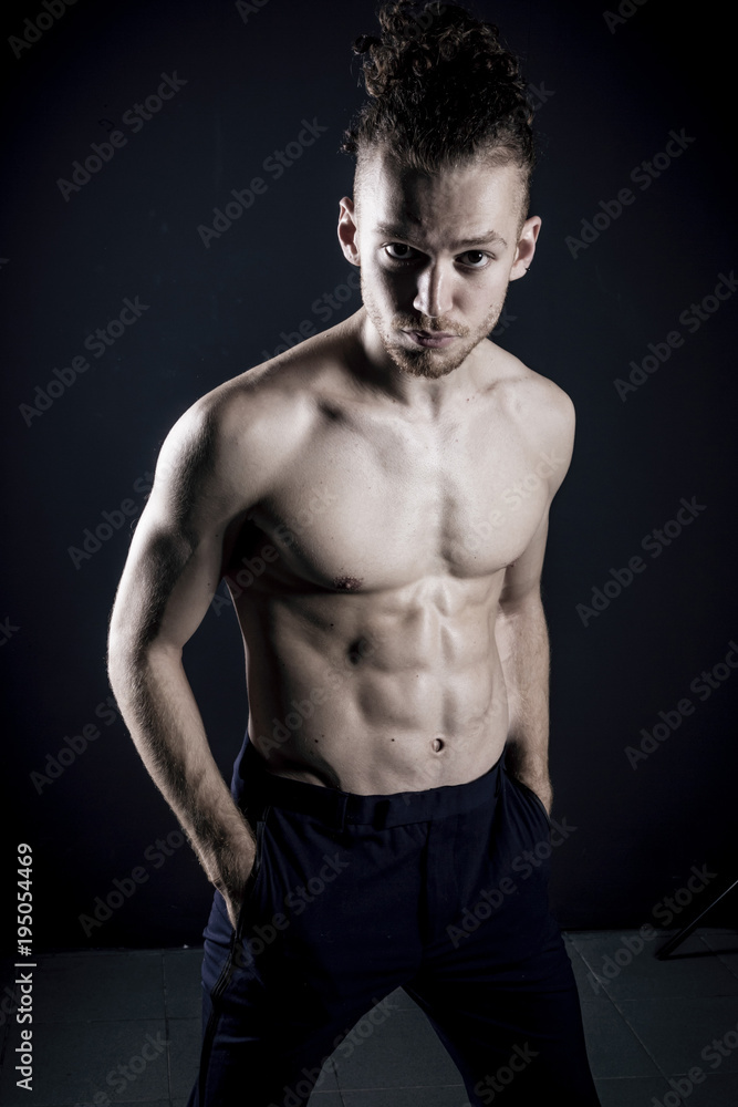 Naklejka premium Young ginger topless man studio portrait