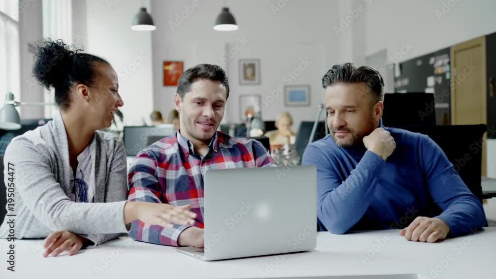 Multi-ethnic colleagues in a coworking office. Multi-ethnic colleagues in a coworking office.