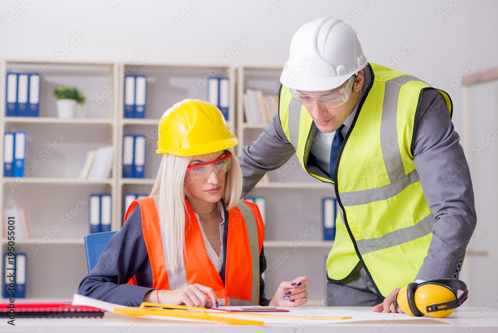 Construction workers having discussion in office before starting Construction workers having discussion in office before starting