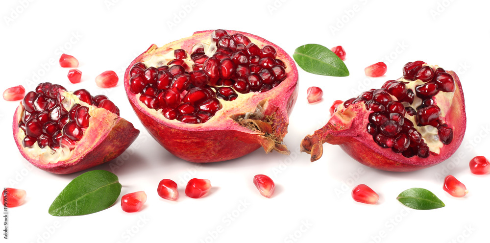 pomegranate fruit with green leaves isolated on a white background pomegranate fruit with green leaves isolated on a white background