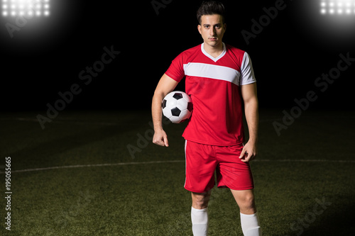 Player standing on soccer field © AntonioDiaz