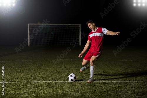 Soccer player kicking the football © AntonioDiaz