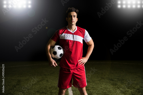 Player with a soccer ball on the field