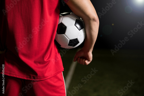 Football player with soccer ball
