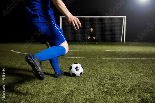 Soccer player making a kick towards the goal