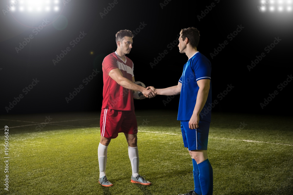 Footballer shaking hands after the game Footballer shaking hands after the game