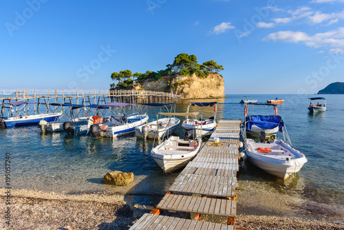 Photography Wooden bridge from Agios Sostis leading to small rocky island