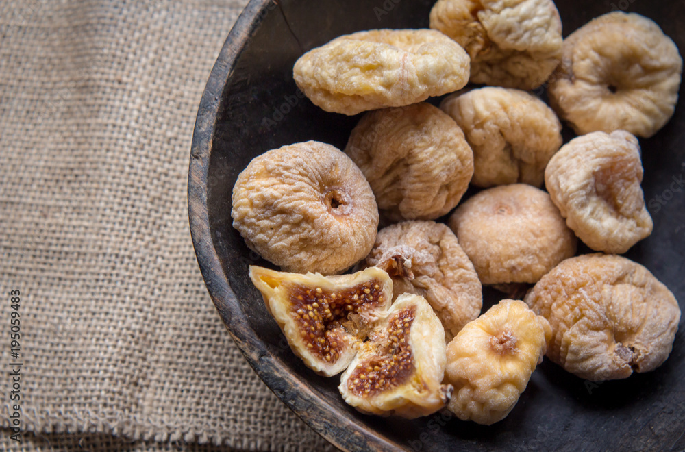 dry figs in rustic wooden bowl dry fruits