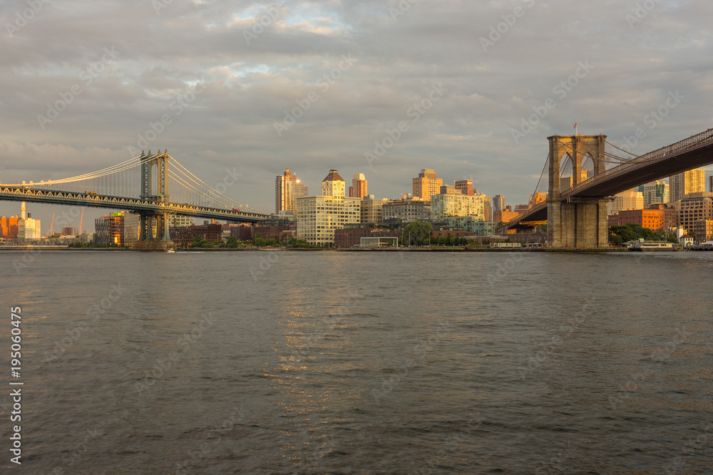 Sunset view of Manhattan Bridge and Brooklyn Bridge, New York