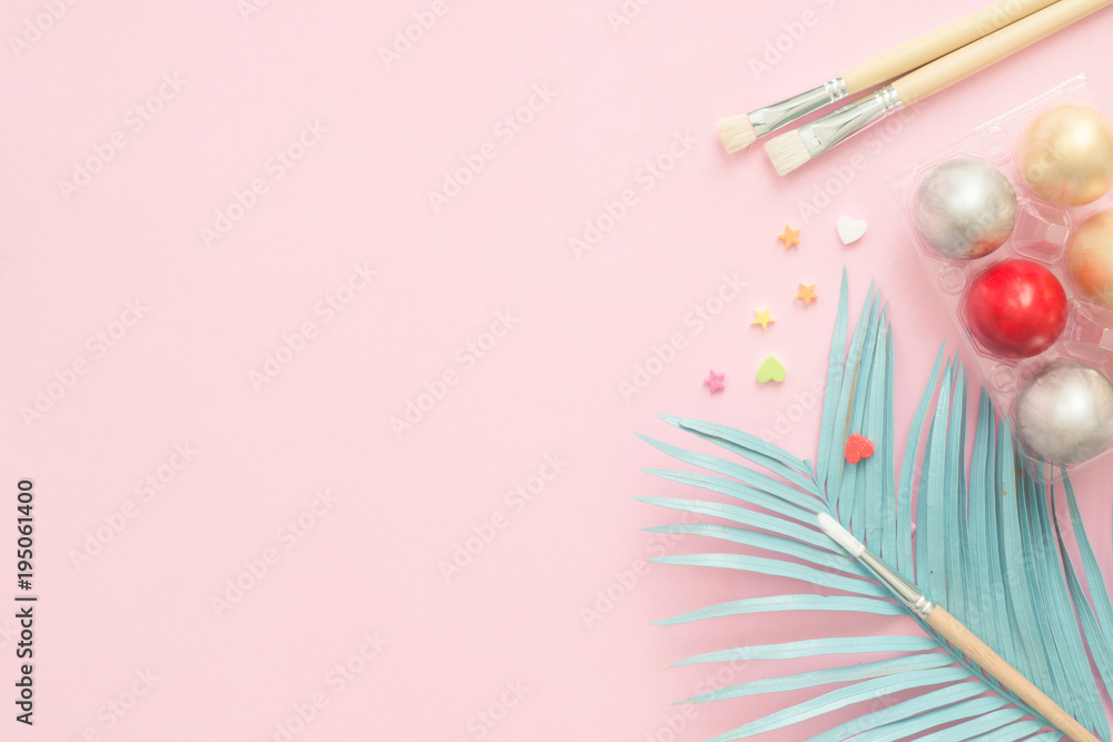 Flat lay top view colorful easter egg painted in pastel colors composition with paint brush on pink pastel color background. Easter day background top view with copy space. Flat lay top view colorful easter egg painted in pastel colors composition with paint brush on pink pastel color background. Easter day background top view with copy space.