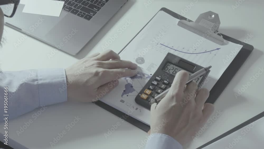 businessman hand working with finances about cost and calculator and laptop with mobile phone on withe desk in modern office
businessman hand working with finances about cost and calculator and laptop with mobile phone on withe desk in modern office