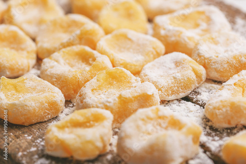 Italian uncooked homemade potato gnocchi with flour. © dzevoniia