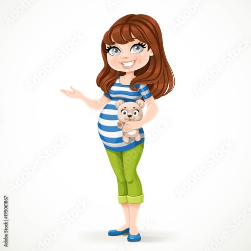 Beautiful pregnant woman in a striped T-shirt is holding a teddy bear in her hand and something tells it pointing to the side isolated on a white background