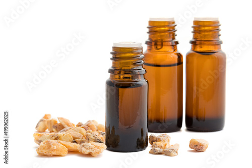 A bottle of styrax benzoin essential oil with benzoin resin