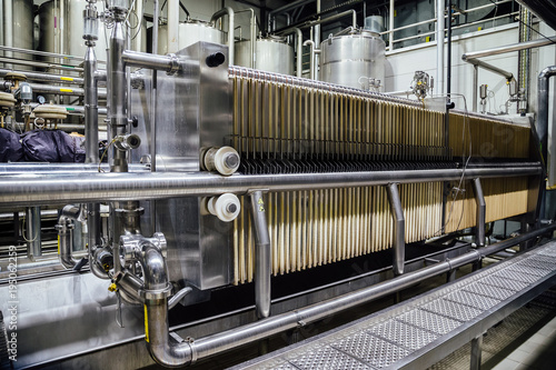 Modern brewery interior. Equipment of beer production line