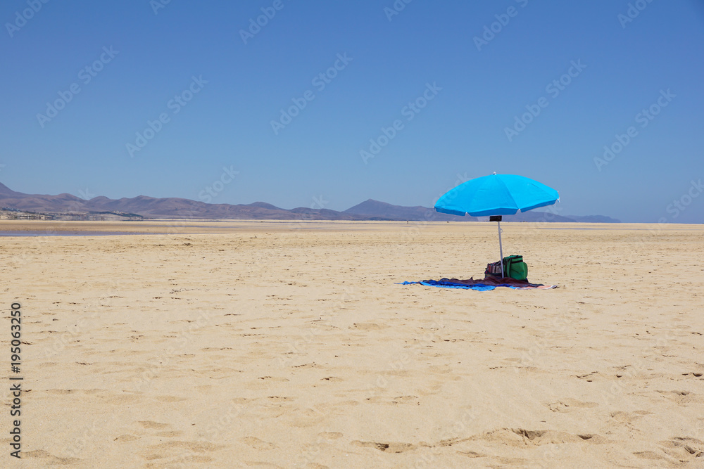 Empty Beach Umbrella in the Desert. Parasol in the desert