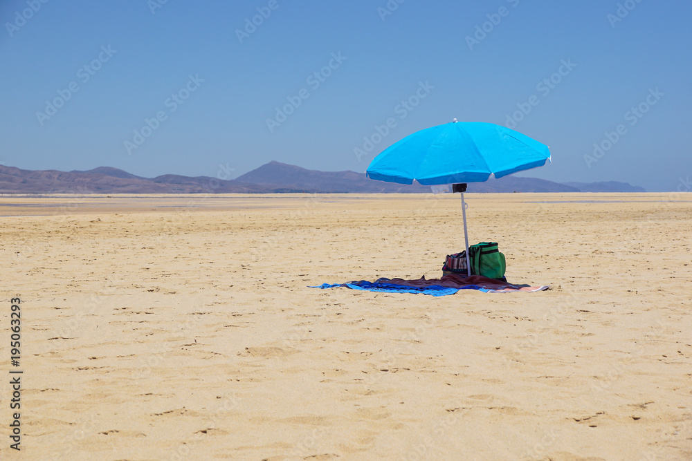 Empty Beach Umbrella in the Desert. Parasol in the desert