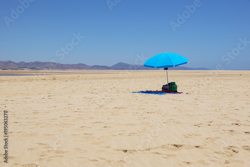 Empty Beach Umbrella in the Desert. Parasol in the desert
