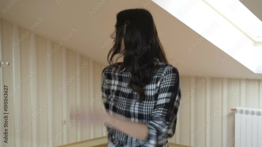 Happy girl with smile walks in home at camera. Slowly Happy girl with smile walks in home at camera. Slowly