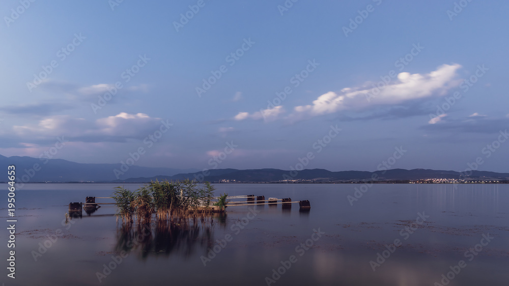 Tranquil evening at lake. Sunset at Dojran lake, FYR Macedonia. Tranquil evening at lake. Sunset at Dojran lake, FYR Macedonia.