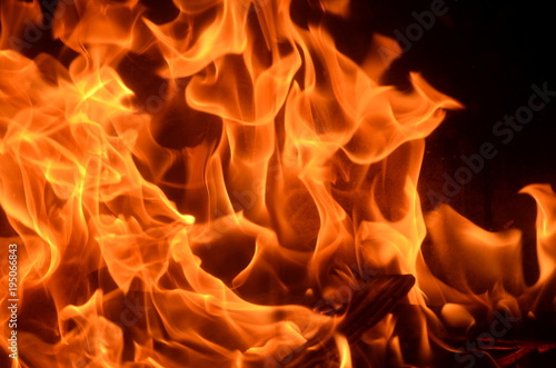 Burning fire with red, orange and yellow flames background