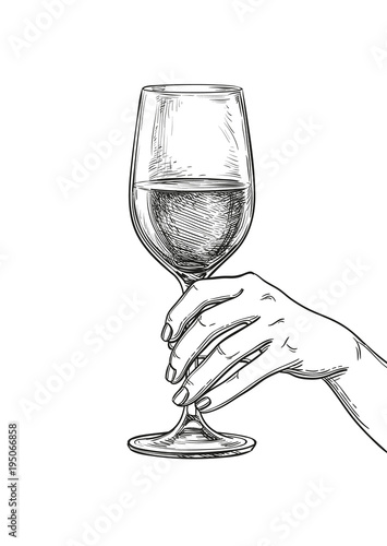 Hand holding a glass of wine.