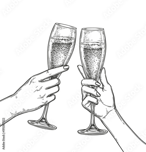 Two hands clinking glasses of champagne.