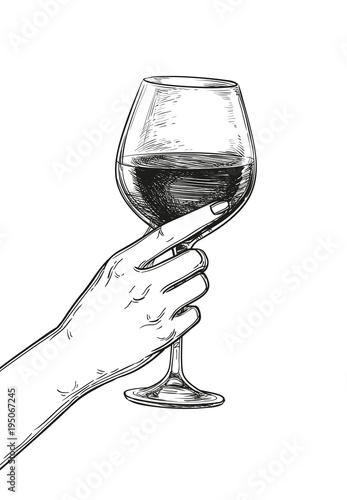 Hand holding a glass of wine.