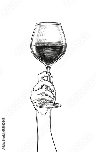 Hand holding a glass of wine.