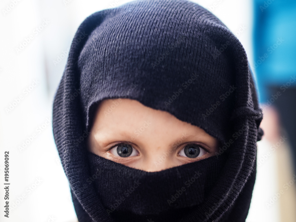 boy wearing a ninja mask.