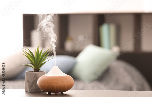 Aroma lamp on table photo
