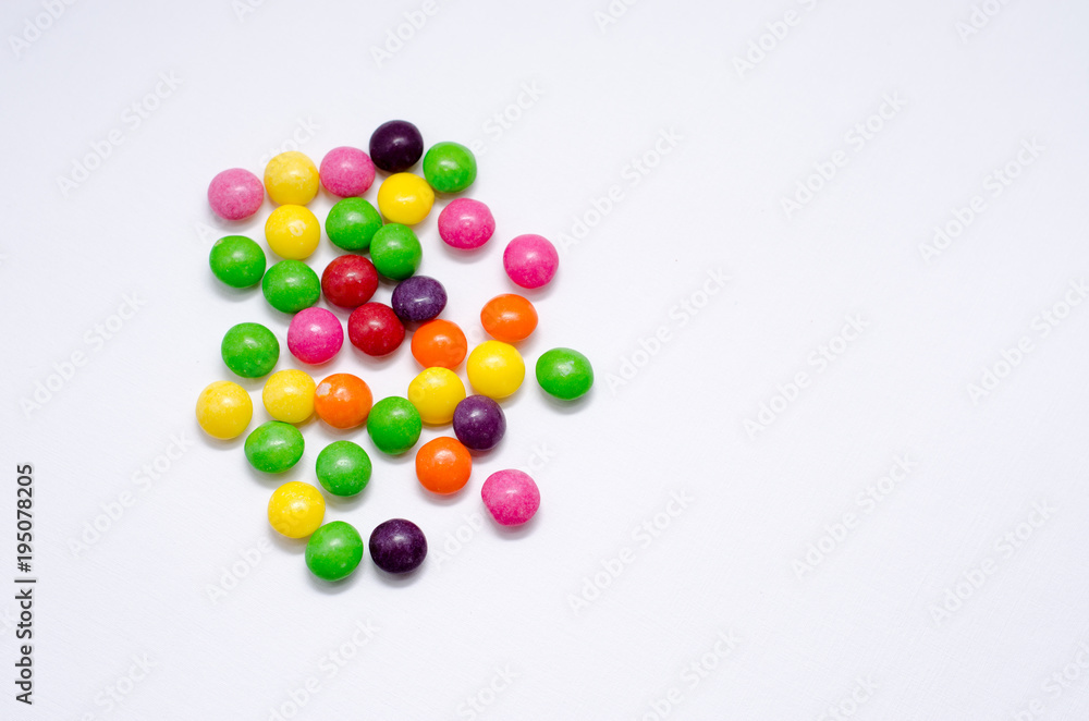Colorful candies on background, Free space for text.