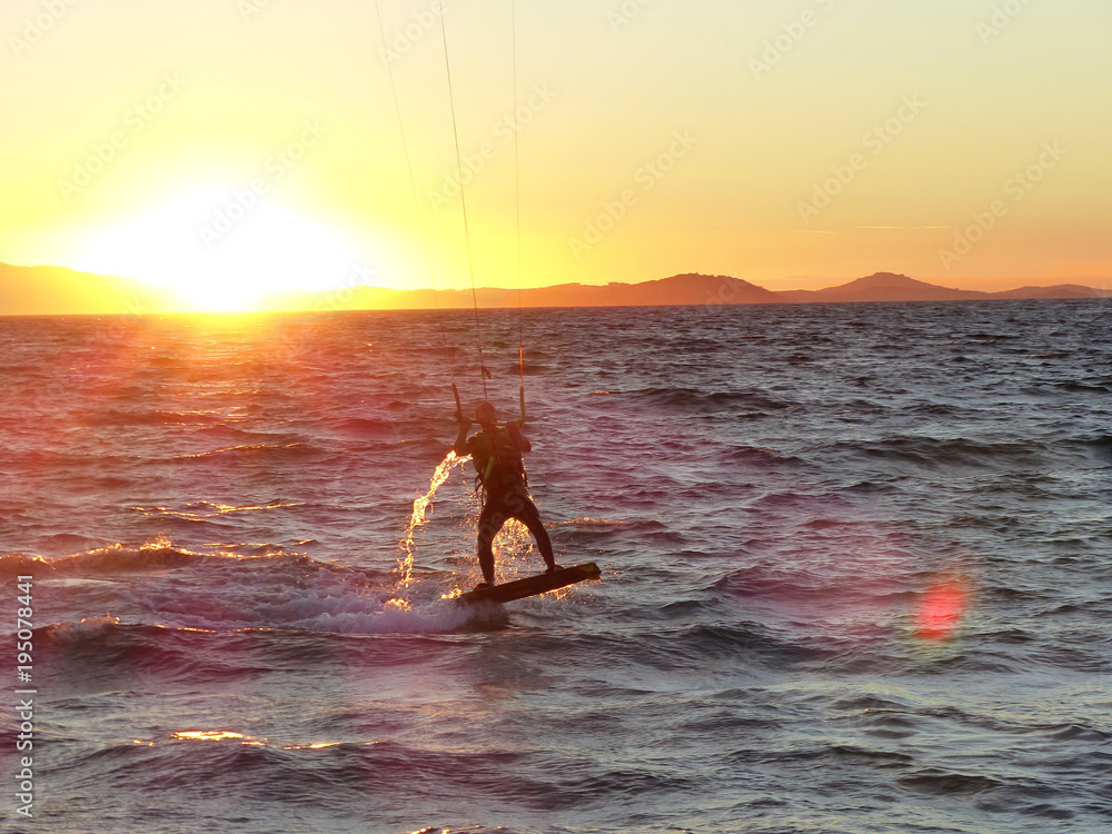 Kitesurfing into the sunset in the south of France