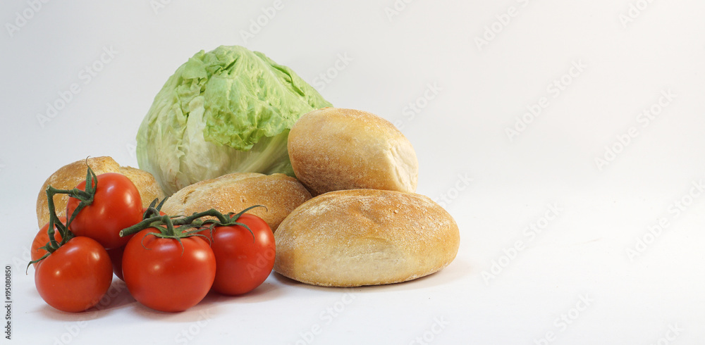 green lettuce red tomatoes and fresh rolls buns green lettuce red tomatoes and fresh rolls buns