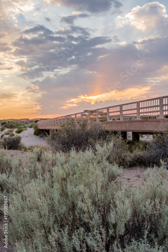 Sunset Over Bridge in Desert