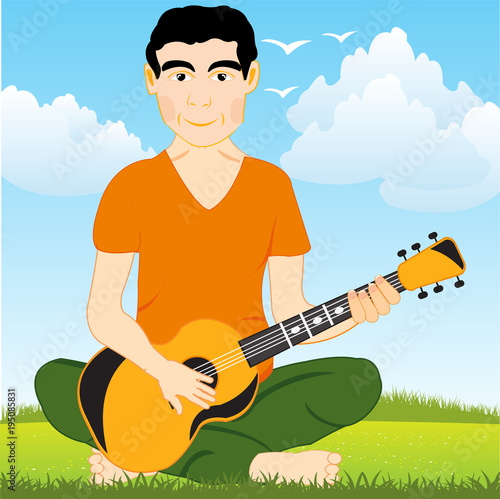 Man on glade plays on guitar