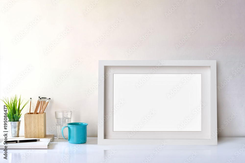 Mockup white poster frame, workspace and supplies. Mockup white poster frame, workspace and supplies.