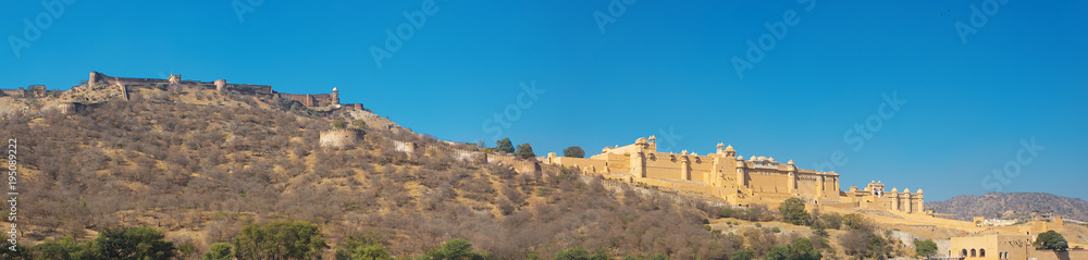 Panorama of Amer Fort and surrounding hills and fortress walls 