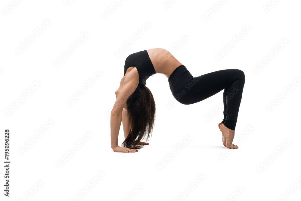 Girl in sportswear doing handstand isolated shot Girl in sportswear doing handstand isolated shot